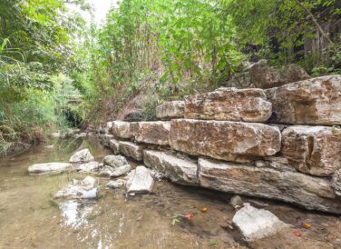 Blunn Creek channel with rock wall